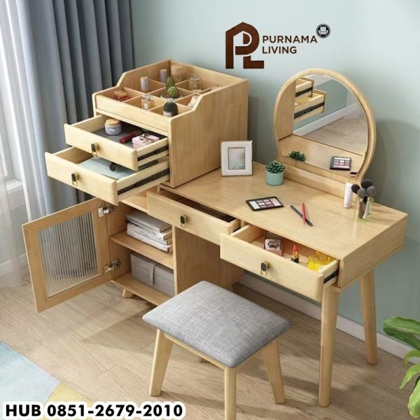 Meja Rias Kayu Jati Minimalis Dengan 4 Laci adalah pilihan sempurna bagi Anda yang mencari furnitur multifungsi dengan desain elegan. Dibuat dari kayu jati berkualitas tinggi, meja rias ini menampilkan keindahan alami dari serat kayu jati yang tahan lama dan awet. Desain minimalisnya cocok untuk berbagai gaya dekorasi kamar, baik modern maupun klasik. Dengan empat laci penyimpanan yang luas, Anda dapat menyimpan berbagai keperluan rias seperti kosmetik, perhiasan, atau aksesori lainnya, menjaga ruang tetap rapi dan terorganisir. Ukuran yang compact membuat meja ini pas untuk ruangan dengan berbagai ukuran, sementara tampilan yang ramping memberikan kesan luas pada kamar tidur Anda. Selain itu, permukaan meja yang halus dan kokoh memudahkan Anda untuk menata peralatan kecantikan atau dekorasi tambahan seperti cermin dan vas bunga. Meja Rias Minimalis Dengan 4 Laci